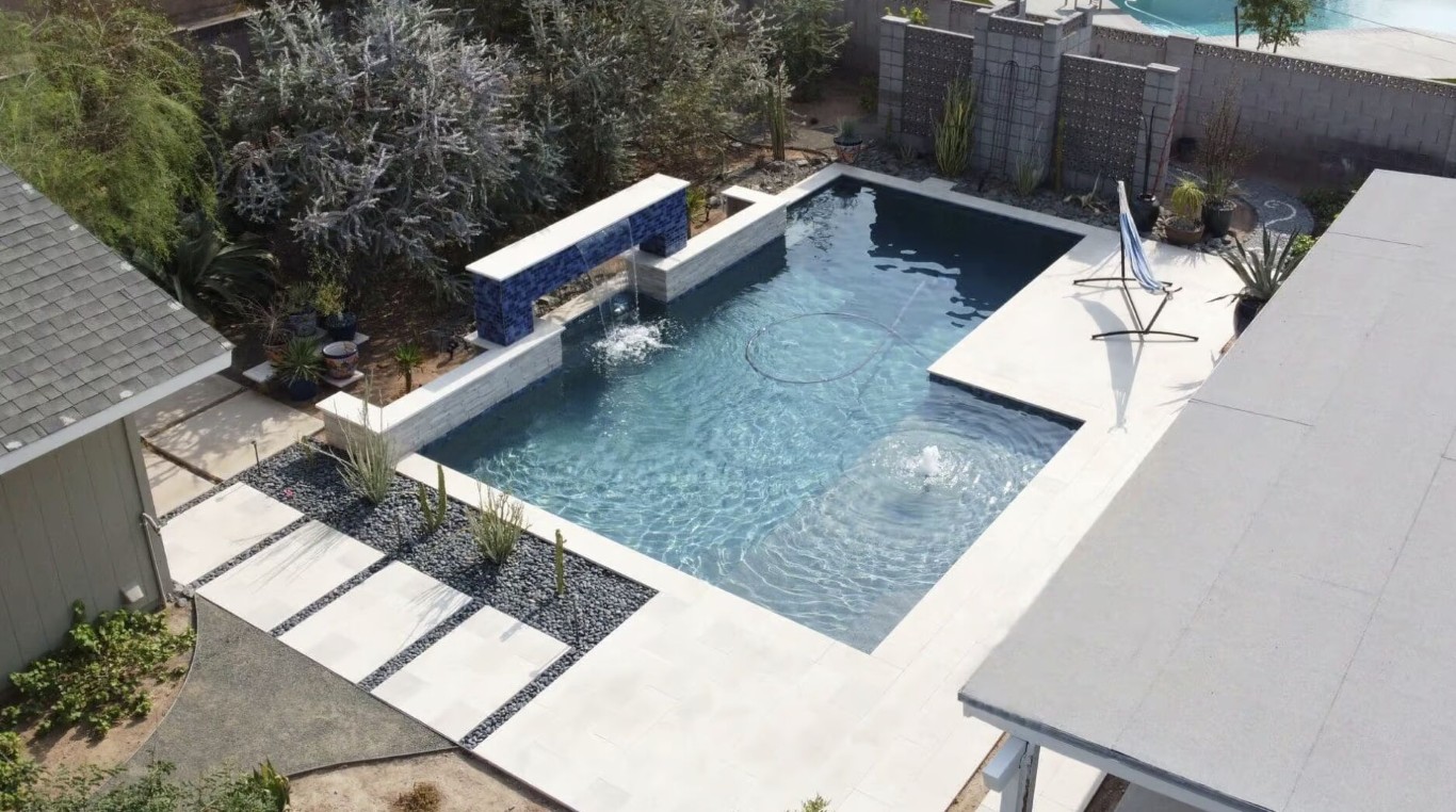 Aerial view of luxury pool receiving weekly professional cleaning service in Paramount, CA